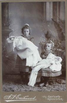photograph of girls with dolls